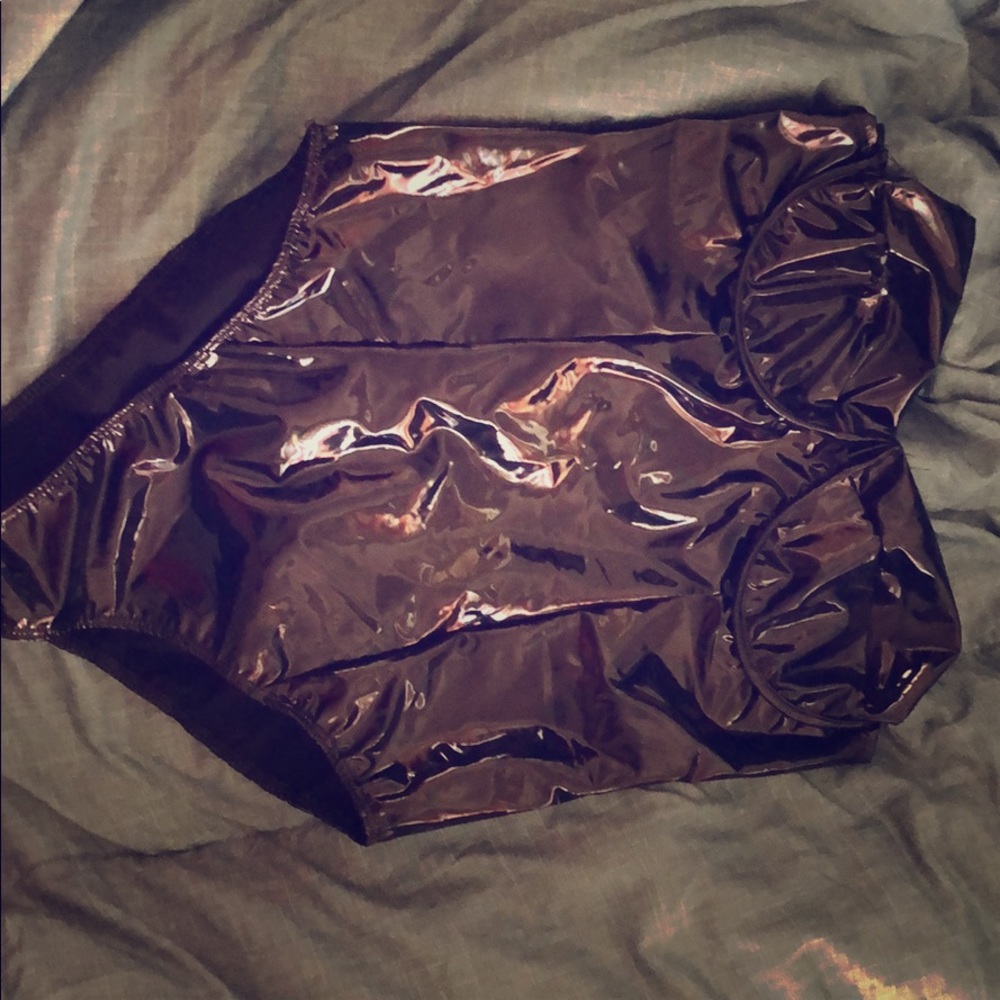 Large black latex body suit